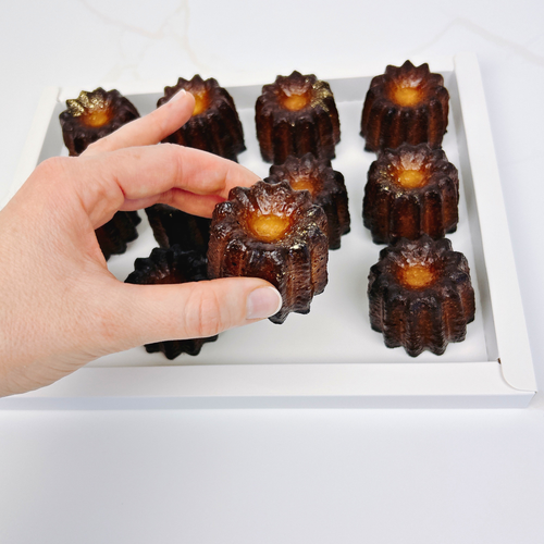 French cannelés close up — caramelised crust and vanilla rum centre | Maison Augustine Newcastle