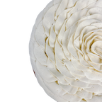Close-up detail of a Chocolate Fondant Cake featuring delicate vanilla bean whipped ganache piped into a handcrafted rose design.