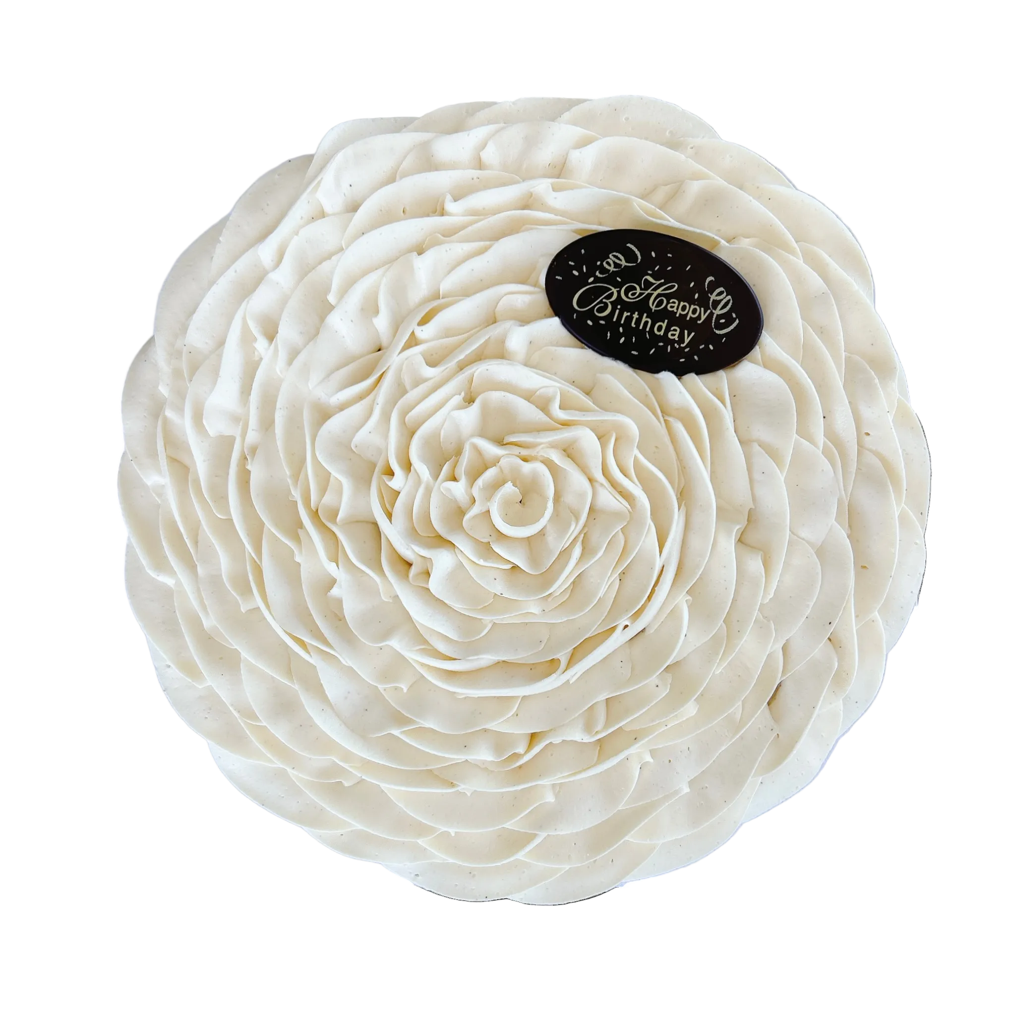 A round cream-colored cake decorated with intricate, layered ruffled frosting resembling a flower, topped with a small black oval cake topper that reads 'Happy Birthday'.