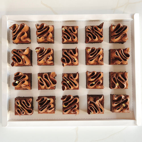 Box of brownies with a swirl pattern on a white background