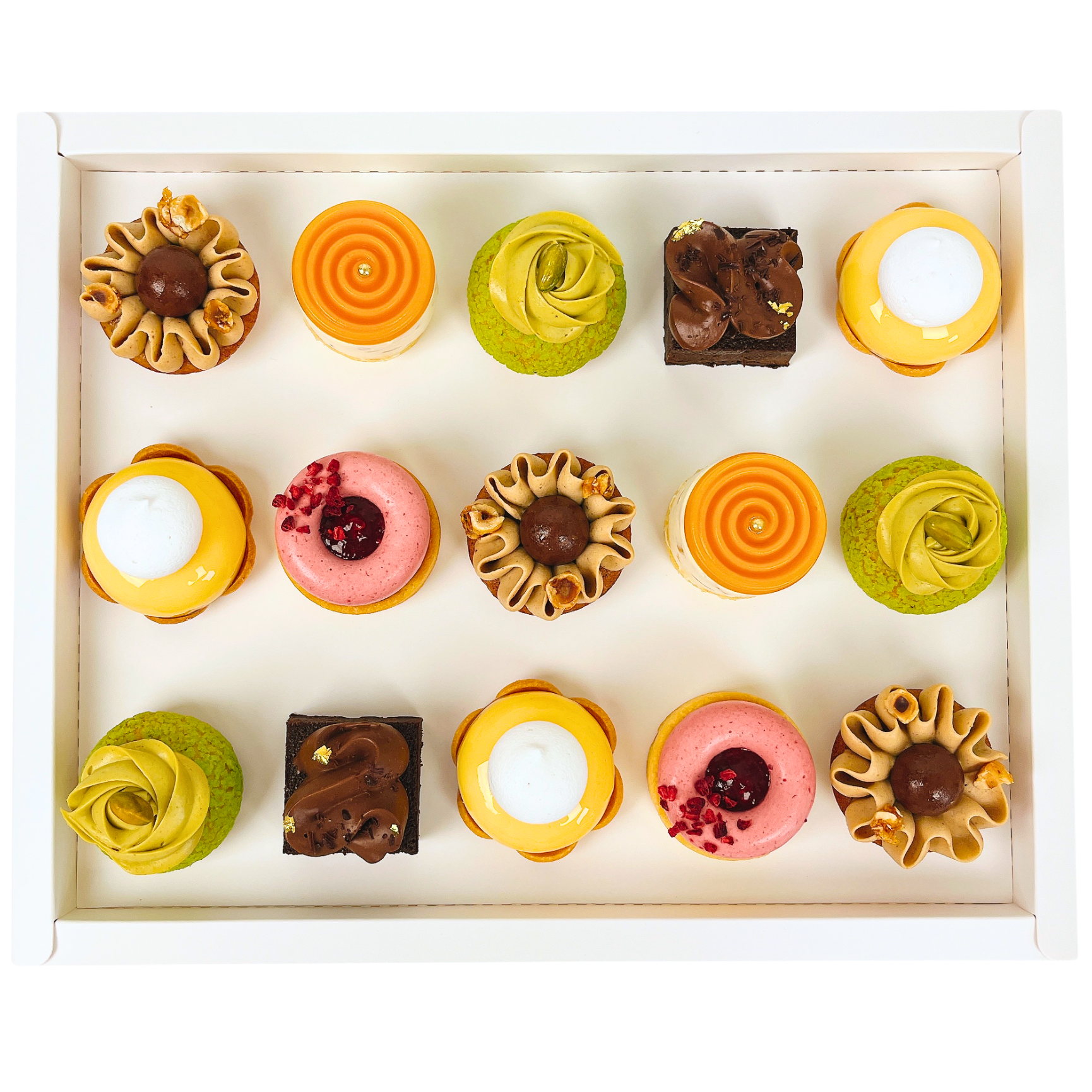 Assorted small pastries in a box on a white background