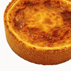 Top view of a traditional French vanilla flan pâtissier with a golden caramelised surface and buttery pastry crust.