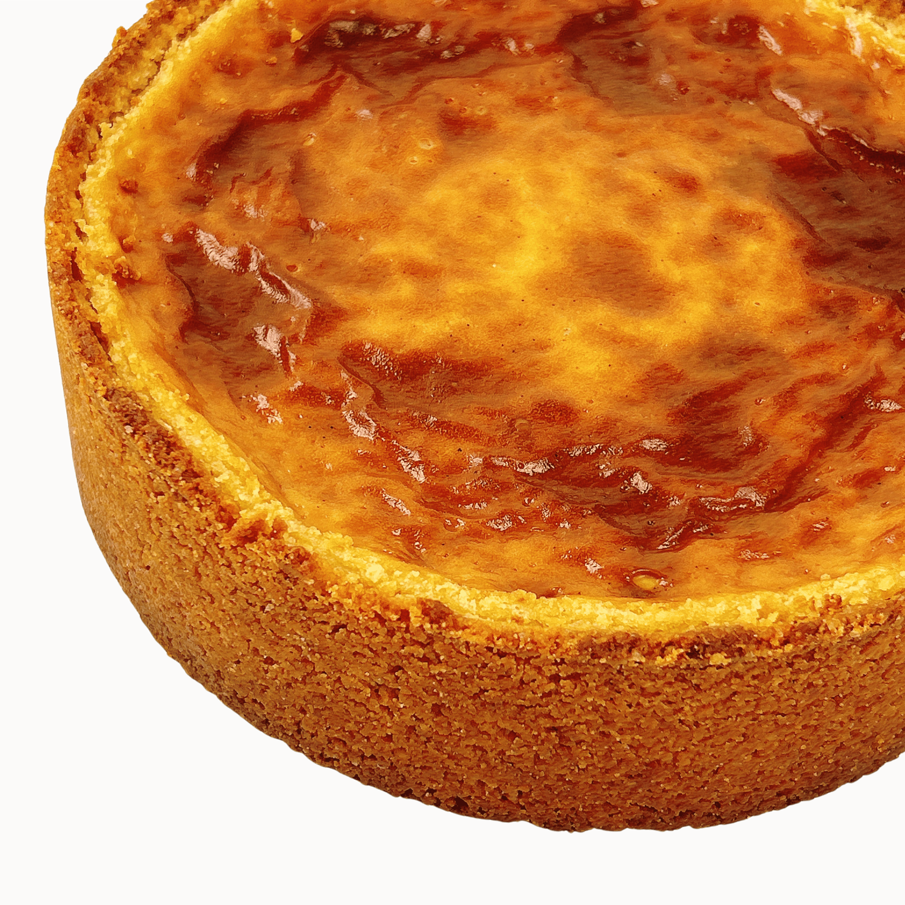 Top view of a traditional French vanilla flan pâtissier with a golden caramelised surface and buttery pastry crust.