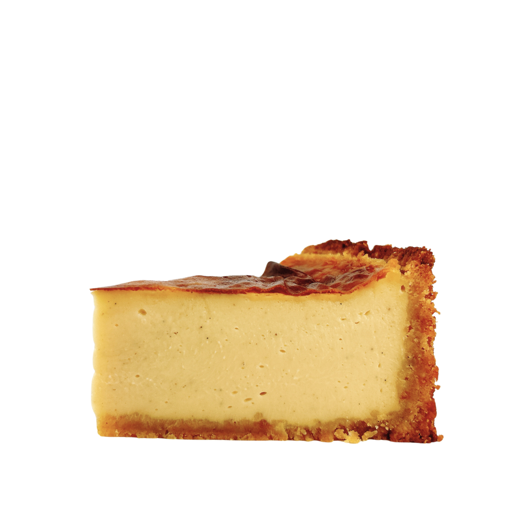 Close-up of a French vanilla flan pâtissier highlighting its silky baked custard, caramelised top and golden pastry crust.