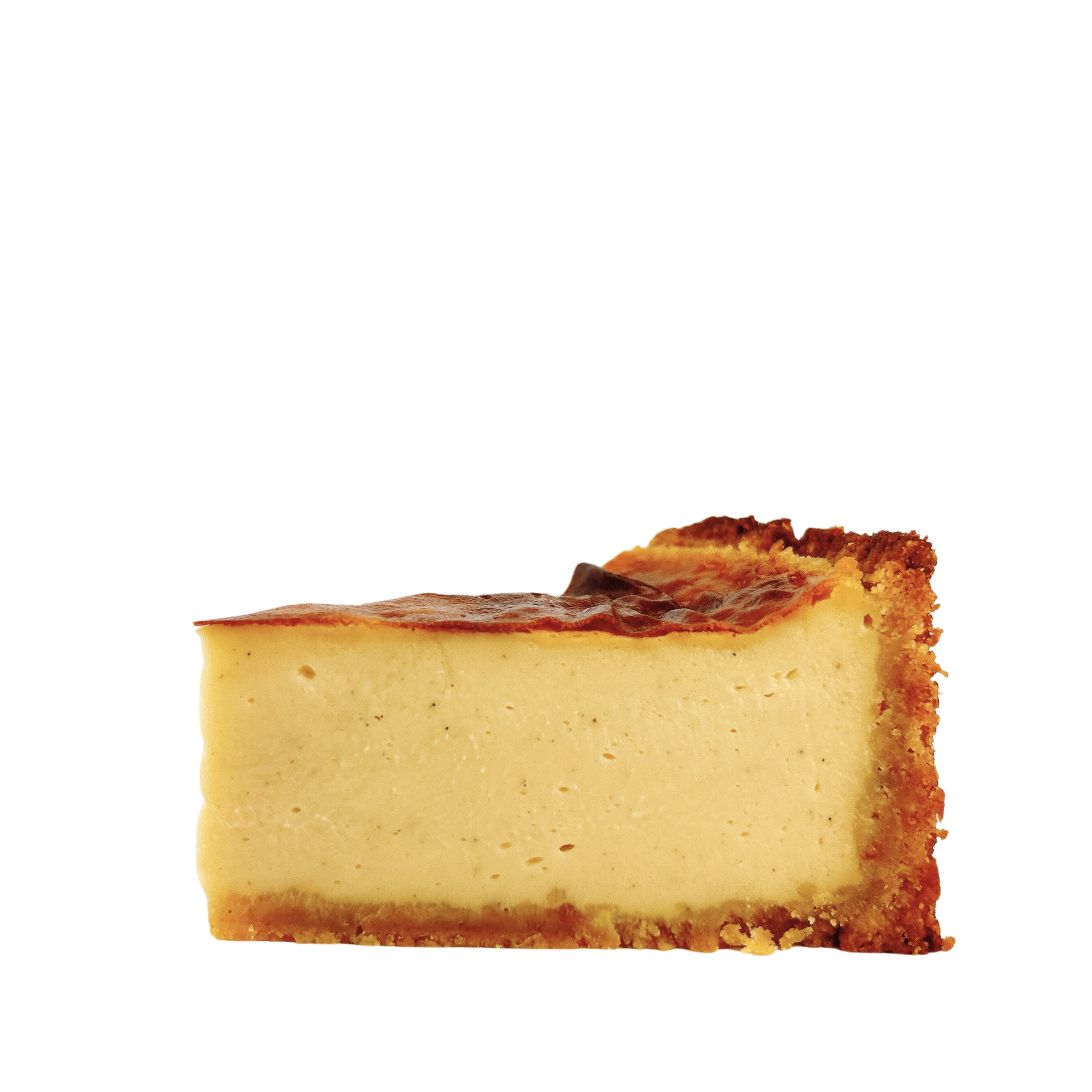 Close-up of a French vanilla flan pâtissier highlighting its silky baked custard, caramelised top and golden pastry crust.