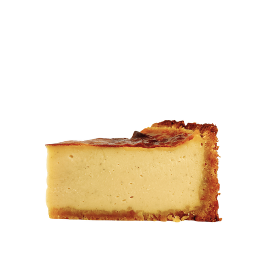 Close-up of a French vanilla flan pâtissier highlighting its silky baked custard, caramelised top and golden pastry crust.