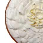 Close-up of a French lemon tart featuring smooth vanilla whipped cream piped into elegant petals and a buttery pastry crust.