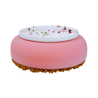 Elegant Red Berry & Coconut French entremet with a pink velvet finish, white coconut spiral décor, pastel sugar flowers and freeze-dried raspberries for celebrations.