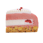 A slice of red berry and coco entremet made in Newcastle nsw, featuring a golden crumb base, a pink berry mousse layer, a white coconut cream layer, and a top of white pannacotta with small red berry accents.